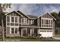 Two-story Craftsman style home with stone accents and a two-car garage at 1522 Ainslie Pl # 42 / Marshall, Indian Trail, NC 28079
