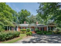 Brick house with columns and lush landscaping at 620 N 9Th St # 5/6, Albemarle, NC 28001