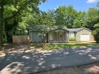 Charming ranch home with a green exterior and a yard at 620 Central Ave, Albemarle, NC 28001