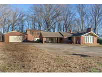Brick ranch house with attached garage and carport at 3616 County Home Rd, Conover, NC 28613
