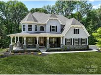 Two-story craftsman style home with a large front porch at 843 Lake Forest Dr # Devonshire, Belmont, NC 28012