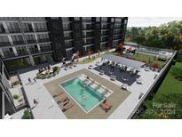 Luxury rooftop pool with ample deck space and grilling area at 9901 Benfield Rd # 109, Charlotte, NC 28269