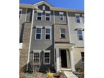 Three story home with gray siding and brick accents at 4227 S New Hope Rd # 10, Cramerton, NC 28032