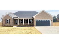 Brick house with a 2-car garage and a covered porch at 3242 Wilson Ct # 17, Lincolnton, NC 28092