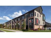 Modern townhomes with brick and dark accents at 1017 North End Dr # 27, Charlotte, NC 28206