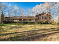 Brick ranch house with covered porch and large yard at 1836 Westbrook Rd, Edgemoor, SC 29712