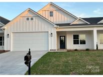 Charming white farmhouse-style home with a two-car garage at 120-B Deer Brook Dr, Shelby, NC 28150