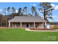 Brick Ranch house with front porch at 1916 Bess Town Rd, Bessemer City, NC 28016