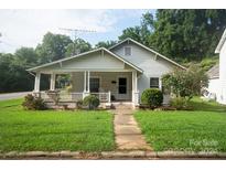 Charming bungalow with front porch and well-maintained lawn at 301 W Washington Ave, Bessemer City, NC 28016