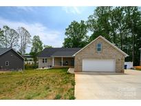 Brick ranch home with attached garage and landscaping at 539 N C Ave, Maiden, NC 28650