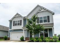 Two-story house with gray siding and white accents at 424 Wharton St, Monroe, NC 28110