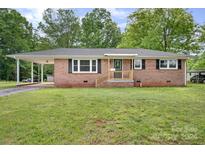 Brick ranch home with covered carport and steps leading to front door at 1900 Sigmon Dairy Rd, Newton, NC 28658