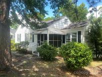White house with screened porch and yard at 6401 N Matson St, Kershaw, SC 29067