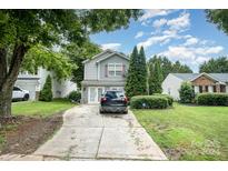 House exterior with driveway and landscaping at 1820 Oakdale Green Dr, Charlotte, NC 28216