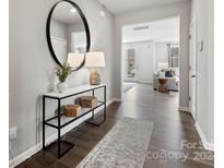 Bright entryway with modern console table and large mirror at 5309 Kinsbridge Dr, Mint Hill, NC 28227