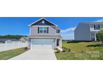 Two-story house with attached garage and well-maintained lawn at 414 Apex Cir, Shelby, NC 28152