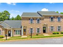 Brick townhouses with two units, featuring shutters and landscaping at 4198 Pickering Dr, Hickory, NC 28602
