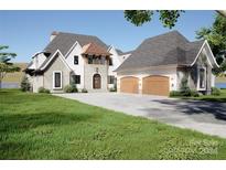 Stunning two-story home with a three-car garage and lake views at 108 Sail High Ct, Mooresville, NC 28117