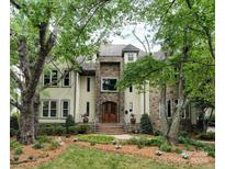 Grand two-story house with stone accents and lush landscaping at 2708 Chilton Pl, Charlotte, NC 28207