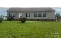 A ranch-style home with a gray exterior and landscaping at 200 Olin Loop, Olin, NC 28660