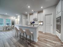 Modern kitchen featuring a large island and stainless steel appliances at 2011 Merida St, Charlotte, NC 28214