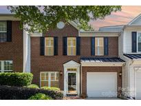 Brick front exterior of charming townhome with attached garage at 1804 Robinwood Village Dr, Gastonia, NC 28054