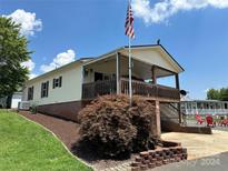 House with large deck and brick base at 231 Badin View Rd, New London, NC 28127
