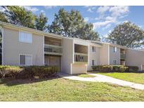 Tan colored multi-unit apartment building with multiple entrances and balconies at 1602 Eagles Pl # J103, Rock Hill, SC 29732