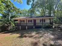 Charming raised ranch home with a covered porch and mature trees at 308 Carpenter St, Kings Mountain, NC 28086