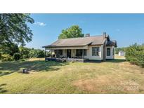 Quaint one-story home with covered porch and large backyard at 243 Love St, McConnells, SC 29726