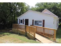 White house with wooden ramp and deck at 410 Clinton Dr, Kings Mountain, NC 28086