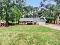 Ranch style home with attached garage and spacious lawn at 138 Bufflehead Dr, Mooresville, NC 28117