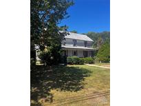 Older home with metal roof and mature trees at 655 Lippard Rd, Salisbury, NC 28146