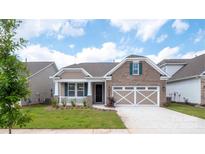 Brick ranch home with 2-car garage and landscaped yard at 9837 Jubilee Ct, Charlotte, NC 28215