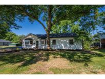 Charming white house with large tree and landscaping at 172 Salem Church Rd, Lincolnton, NC 28092