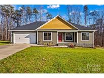 Gray house with a two-car garage and a red door at 746 Whites Farm Rd, Statesville, NC 28625