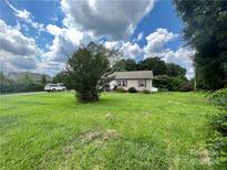 Ranch home with spacious lawn and mature trees at 5401 Stevens Mill Rd, Matthews, NC 28104