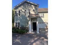 Two-story house with light green siding and columns at 1376 21St Ne Ave, Hickory, NC 28601