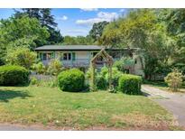Two-story house with green accents and landscaped yard at 1099 4Th Avenue Nw Dr, Hickory, NC 28601