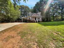 Exterior view of charming house with a lush lawn at 2008 Sarn Ct, Gastonia, NC 28054