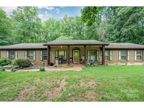 Ranch style home with brick facade and covered porch at 1901 Davenport St, Newton, NC 28658