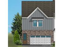 Exterior of townhome with garage at 10607 Audubon Ridge Dr # 27, Cornelius, NC 28031