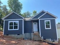 Newly built home with gray siding and white trim, featuring a simple design at 1225 39Th Sw St, Hickory, NC 28602