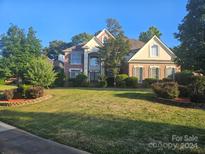 Two-story house with brick and siding exterior at 2301 Treymore Ln, Charlotte, NC 28262