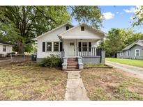 White bungalow with a front porch at 323 20Th St, Kannapolis, NC 28083