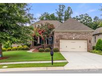 Brick ranch house with 2-car garage and landscaping at 15814 Vale Ridge Dr, Charlotte, NC 28278