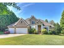 Brick and shingle two-story house with a large yard at 118 Broadbill Dr, Mooresville, NC 28117