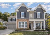 Two-story house with gray siding and stone accents at 1234 Englewood Dr, Lake Wylie, SC 29710