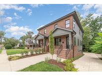 Two-story brick home with gray accents and landscaped yard at 2112 Kirkwood Ave, Charlotte, NC 28203