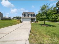 Two-story home with a driveway and landscaping at 209 Churchill Dr, Kings Mountain, NC 28086